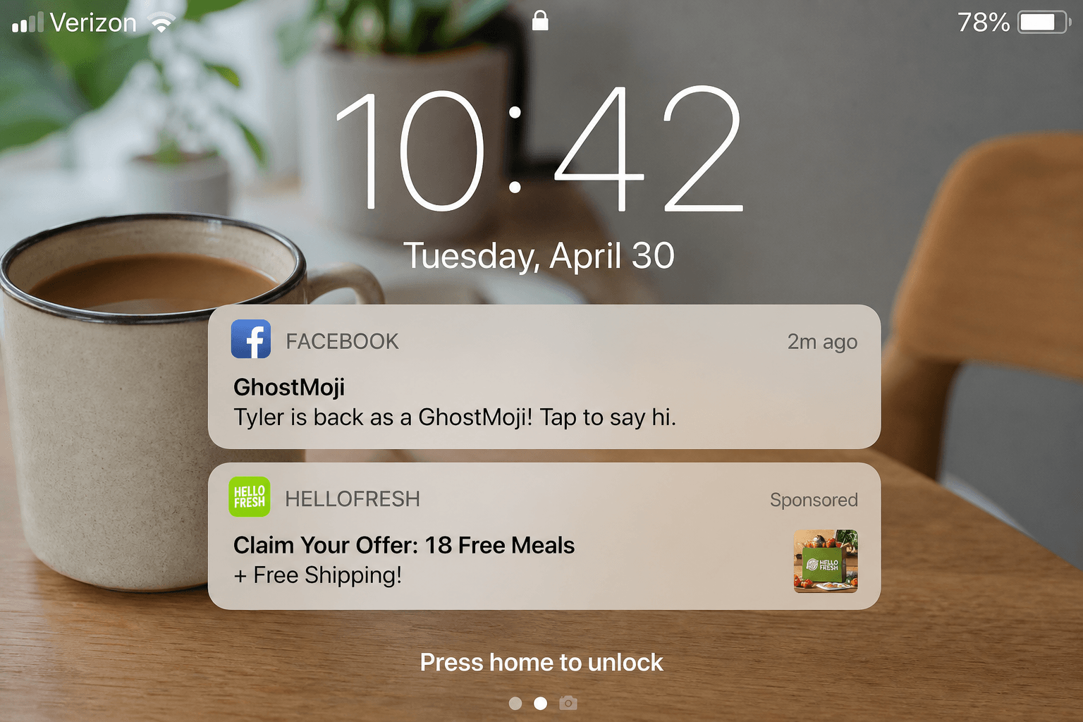 A lock screen with a Facebook GhostMoji notification and a HelloFresh ad